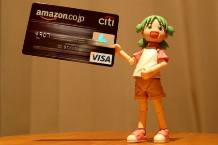 credit card number visa debit. Anime doll holding VISA card