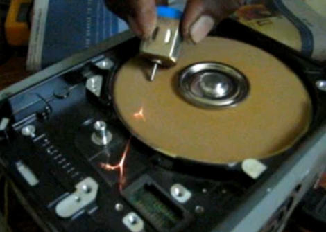 [Mhkabir] opened up an older hard drive, removed the read head, and added a 