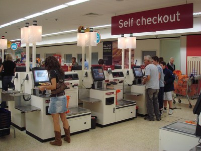 "Self checkout using NCR Fastlane machines" by pin add - Self CheckoutUploaded by SchuminWeb. Licensed under CC BY 2.0 via Commons - https://commons.wikimedia.org/wiki/File:Self_checkout_using_NCR_Fastlane_machines.jpg#/media/File:Self_checkout_using_NCR_Fastlane_machines.jpg