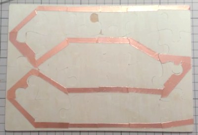 Copper strip on back of puzzle
